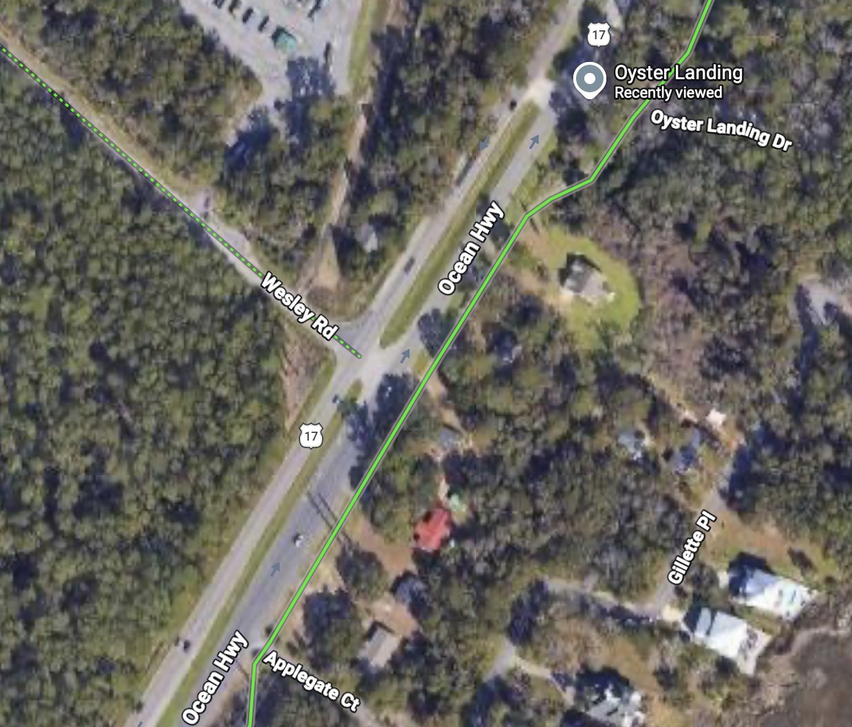 Aerial view of Wesley Road meeting US Highway 17 in Murrells Inlet. The Greenway Walkway runs alongside the highway as a solid green line. A dotted green line marks Wesley Road as a bicycle-friendly road, and it stops where it reaches US 17.